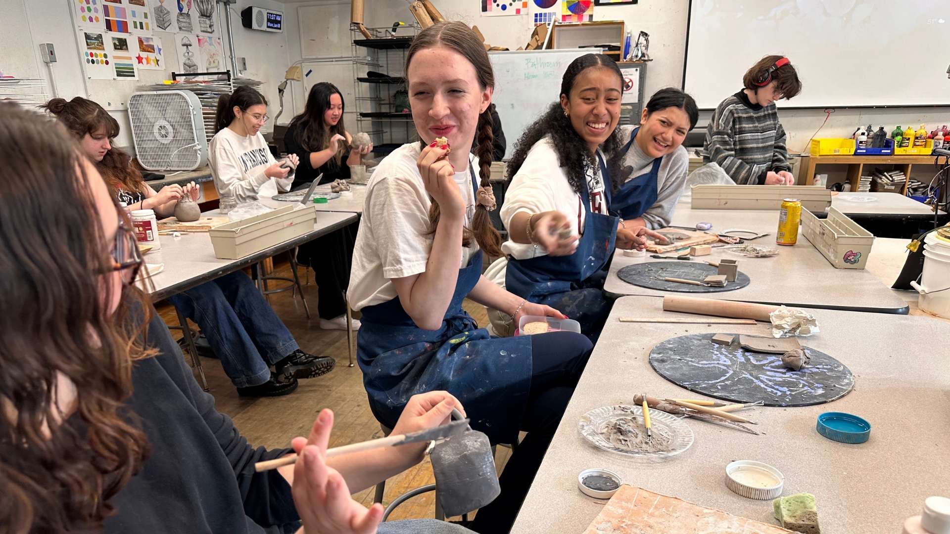 Students having fun doing crafts in a classroom