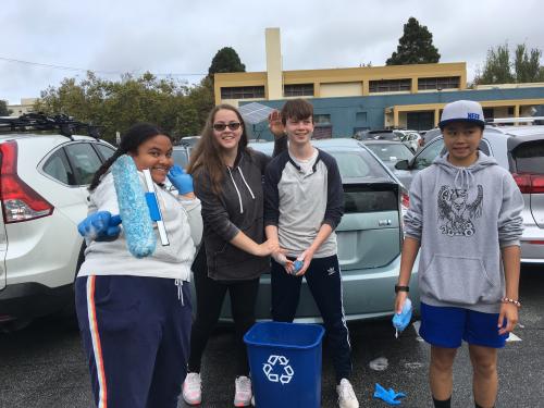 Student participate in a car wash for charity