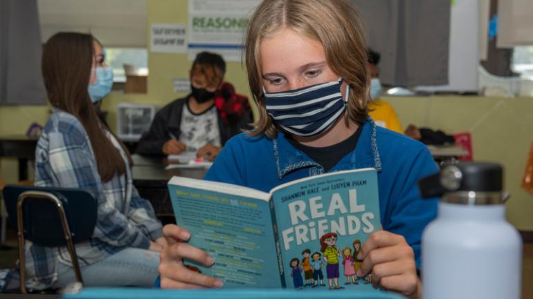 student reading a book