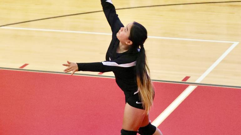 Chloe playing volleyball