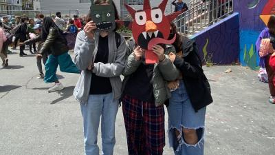 students show off masks