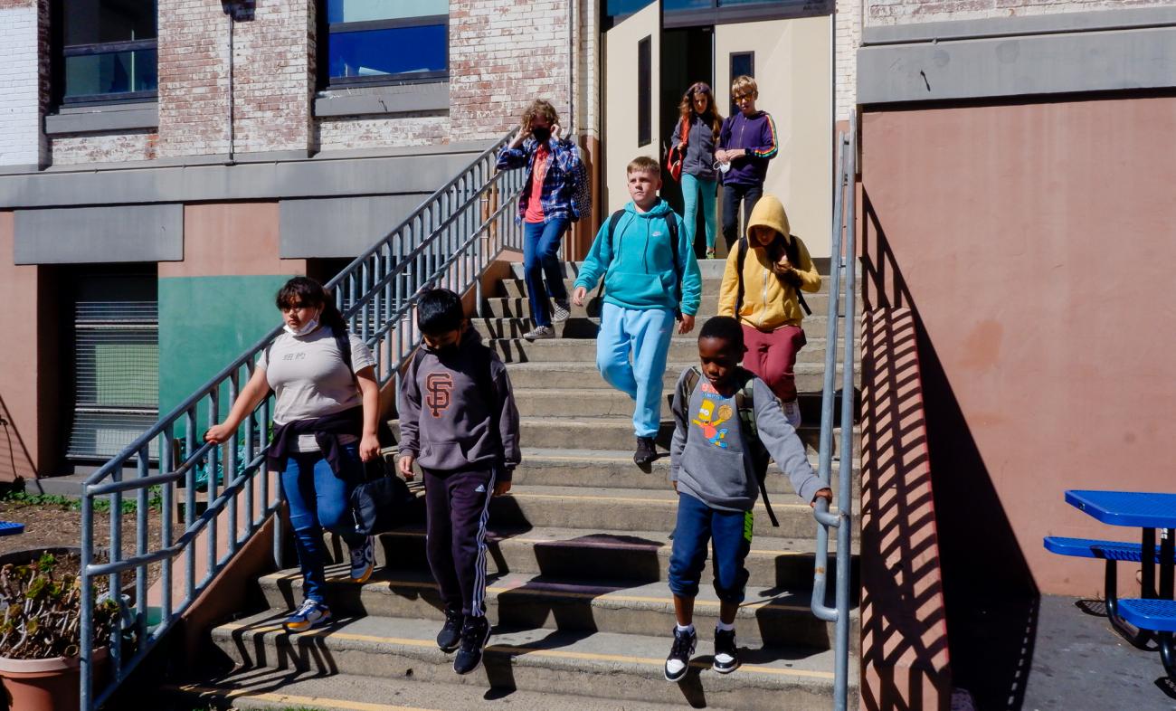 students walking down stairs