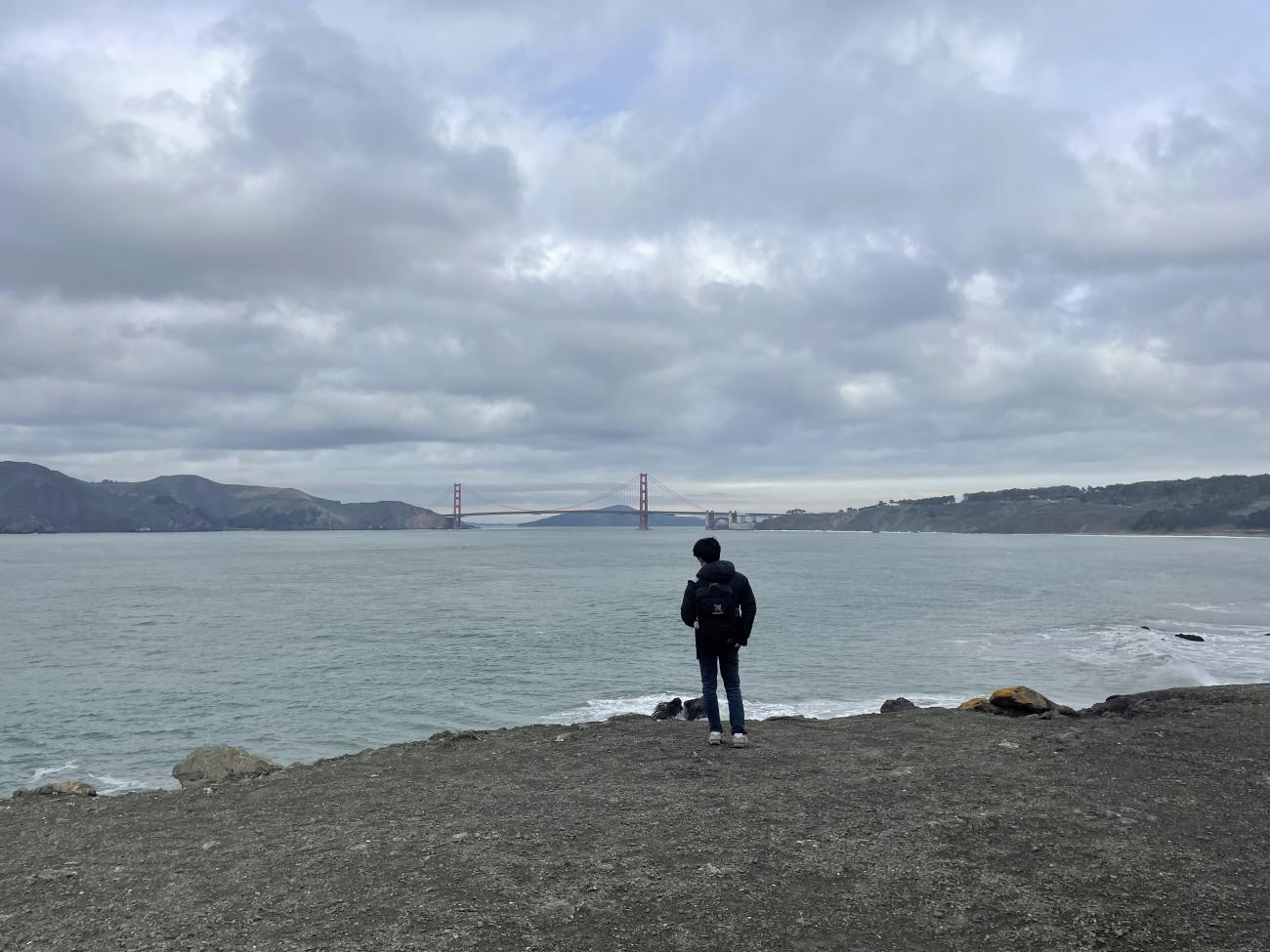 student in front of the SF bay
