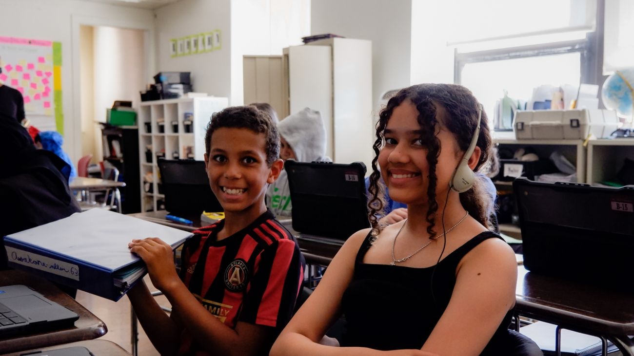 Two students in a lab with laptops