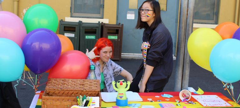 Students man a table for the GSA at Club Day